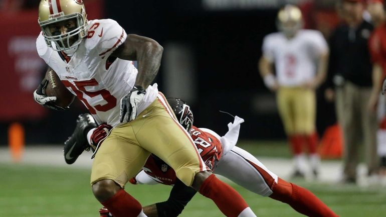 San Francisco 49ers' Vernon Davis (85) catches a pass with...