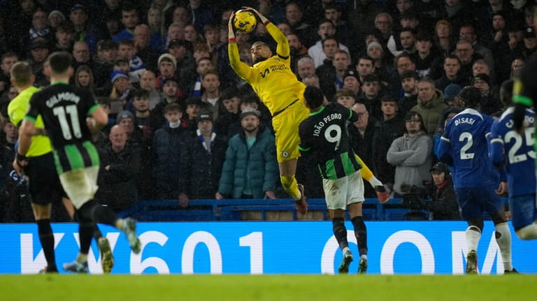 Chelsea's goalkeeper Robert Sanchez catches the ball during the English...