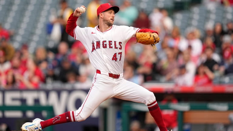 Los Angeles Angels starting pitcher Griffin Canning throws to the...