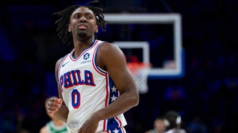 Philadelphia 76ers' Tyrese Maxey stands on the court after hitting...