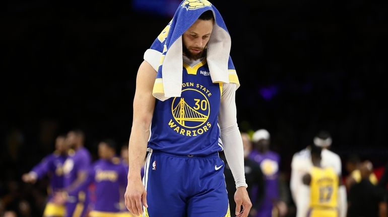 Golden State Warriors guard Stephen Curry stands during a timeout...