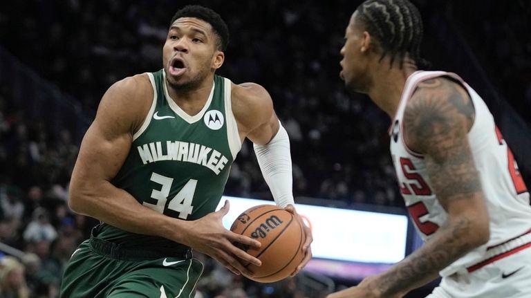 Milwaukee Bucks' Giannis Antetokounmpo drives past Chicago Bulls' Dalen Terry...