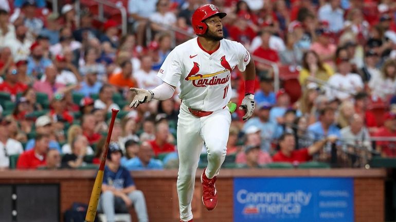 St. Louis Cardinals' Victor Scott II runs after hitting a...