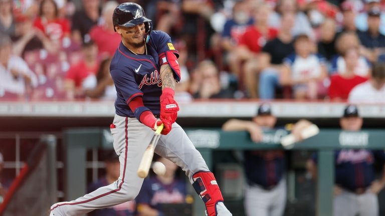 Atlanta Braves' Orlando Arcia hits a ground ball against the...