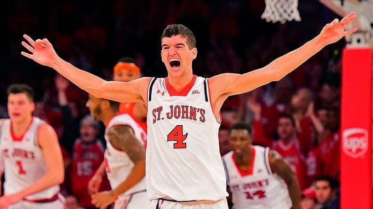 St. John's guard Federico Mussini (4) reacts after a basket...