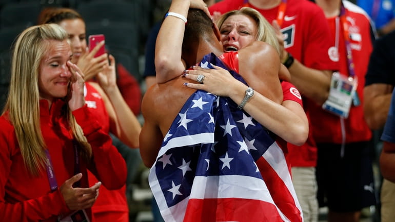 United States' Ashton Eaton gets a hug from his mother...