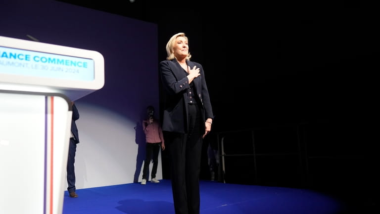 French far right leader Marine Le Pen gestures after delivering...