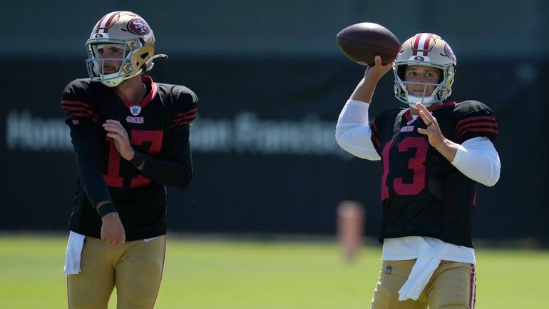 San Francisco 49ers quarterbacks Brandon Allen (17) and Brock Purdy...