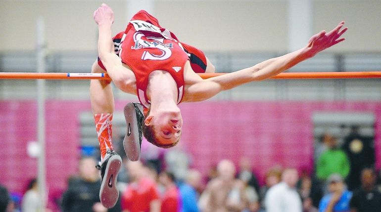 Smithtown East's Daniel Claxton clears 6-10 in the high jump...