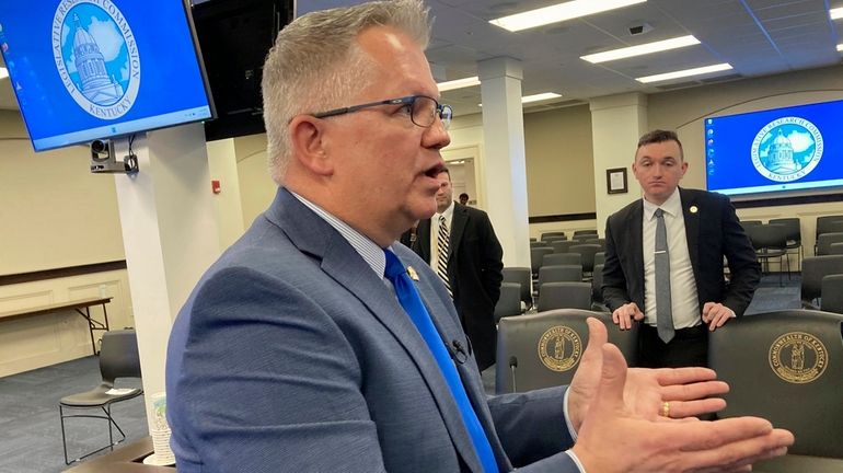 Kentucky state Sen. Danny Carroll speaks with reporters, Feb. 20,...