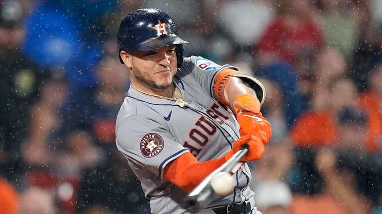 Houston Astros' Yainer Diaz hits a two-run home run during...