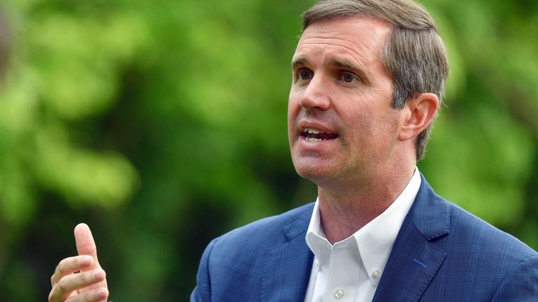 Kentucky Gov. Andy Beshear sits for an interview in Versailles,...