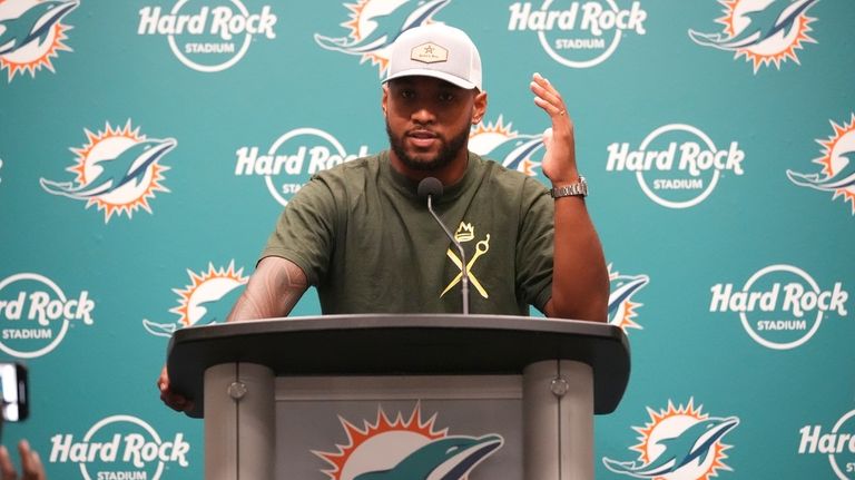 Miami Dolphins quarterback Tua Tagovailoa speaks during a news conference...