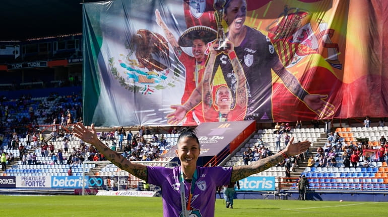 Pachuca's Jenni Hermoso smiles during a tribute before a Mexican...