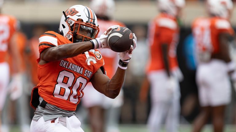 Oklahoma State wide receiver Brennan Presley (80) catches a pass...