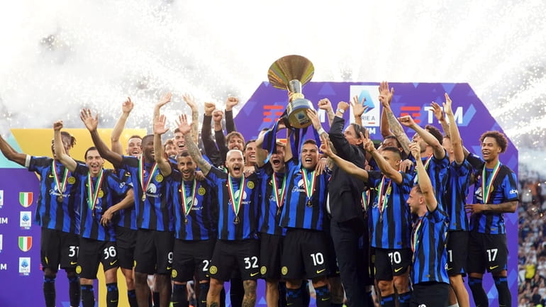 Inter players celebrate their victory of the "scudetto" after the...