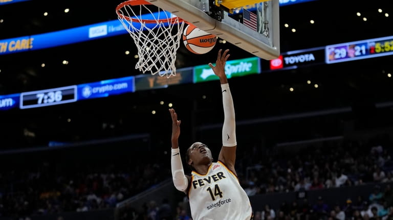 Indiana Fever center Temi Fagbenle (14) shoots during the first...