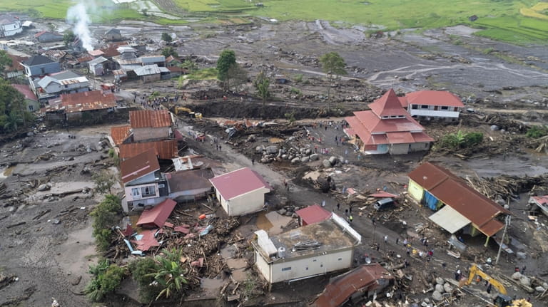 This drone photo shows the damage at a village affected...