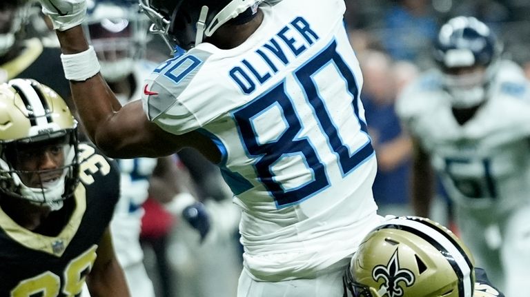 Tennessee Titans wide receiver Bryce Oliver catches a touchdown pass...