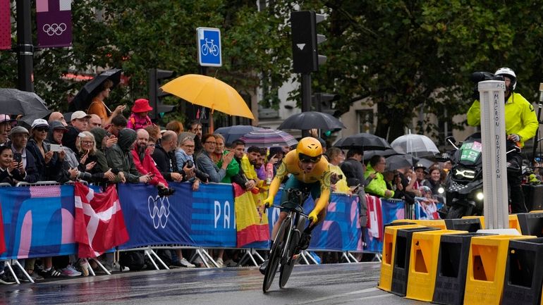 Grace Brown, of Australia, competes in the women's cycling time...