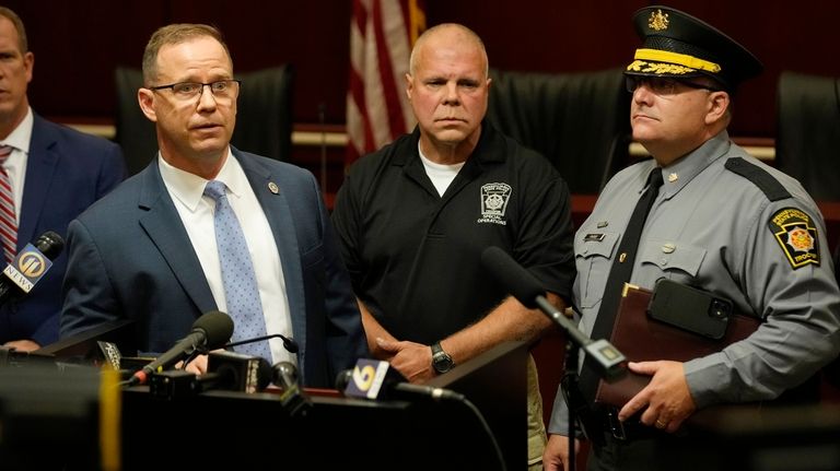 Kevin Rojek, left, FBI special agent in charge, Lt. Col....