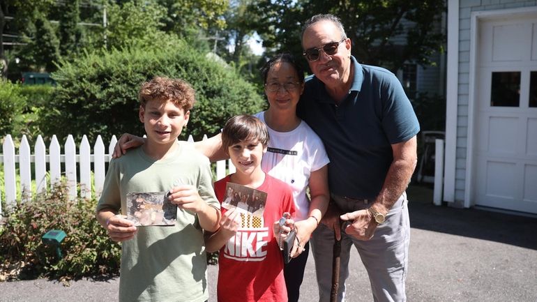 Ron and Hui Borghese with Alex Canosa, 12, and his brother...