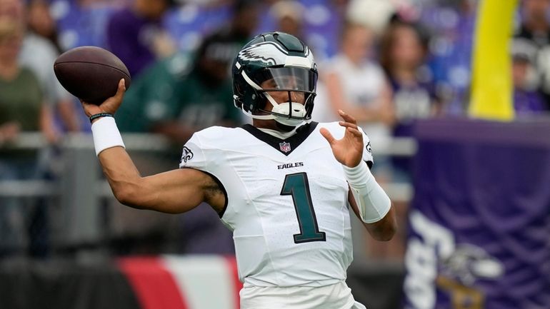 Philadelphia Eagles' Jalen Hurts warms up before a preseason NFL...