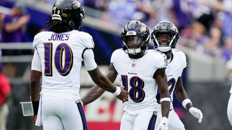 Baltimore Ravens wide receiver Dayton Wade celebrates after scoring with...