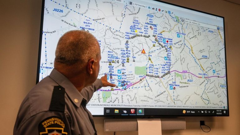 Lt. Col George Vivens shows th map of the area...