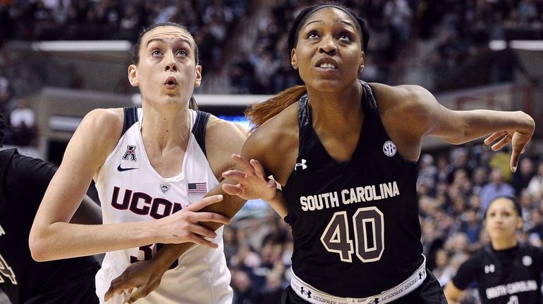 Connecticut's Breanna Stewart, left, and South Carolina's Jatarie White, right,...