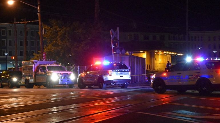 Police on the scene where a Long Island Rail Road train...