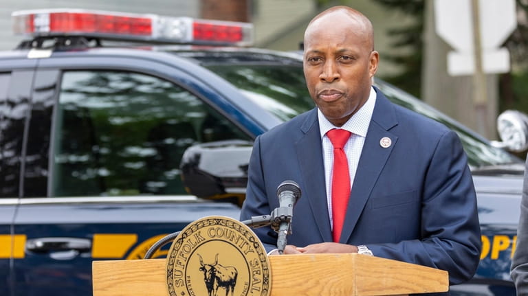 Suffolk County Police Commissioner Rodney K. Harrison announces the arrest...