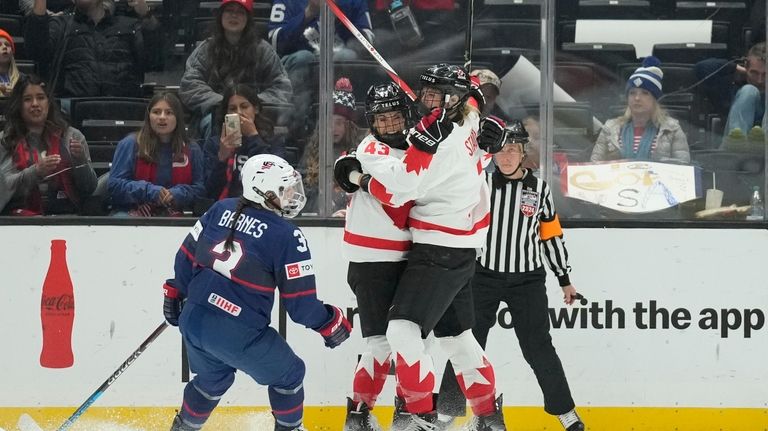 Canada forward Laura Stacey (7) celebrates with forward Kristin O'Neill...