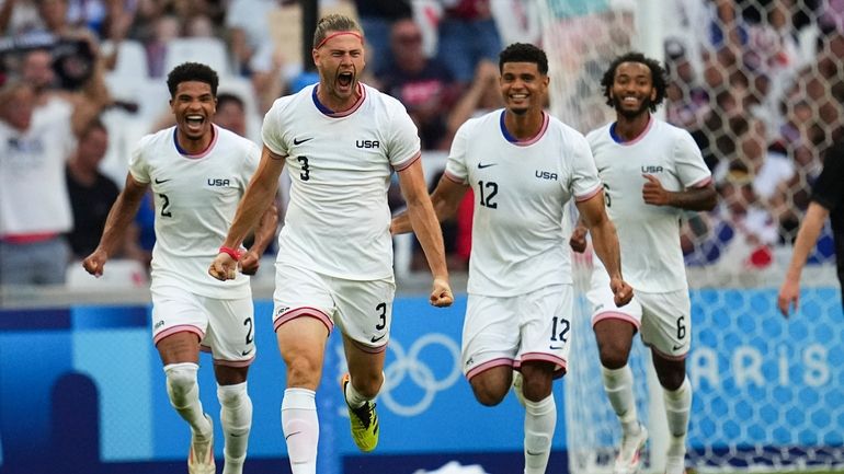 United States' Walker Zimmerman, center, celebrates after scoring his side's...