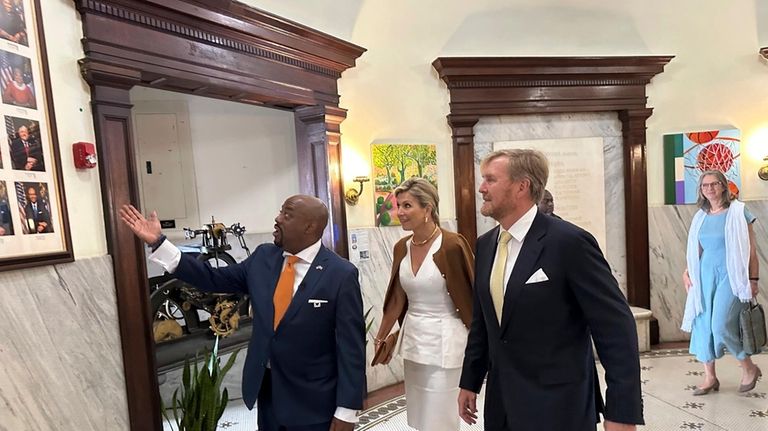 King Willem-Alexander, left, and Queen Maxima of the Netherlands get...