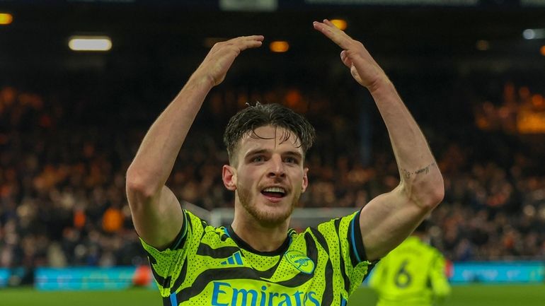 Arsenal's Declan Rice celebrates after scoring his side's fourth goal...