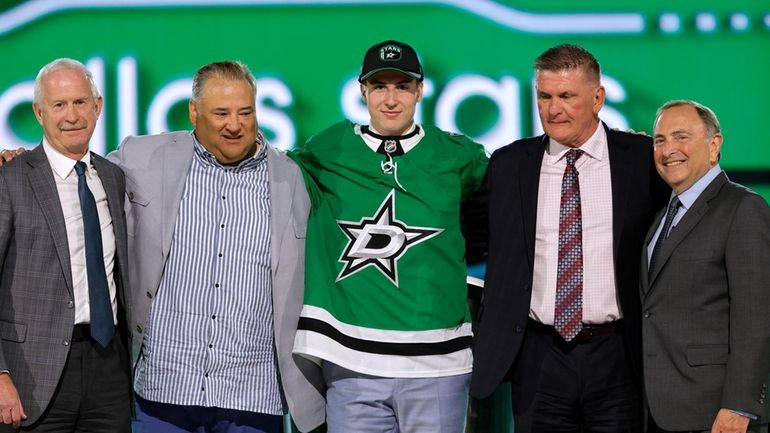 Emil Hemming, center, poses after being selected by the Dallas...