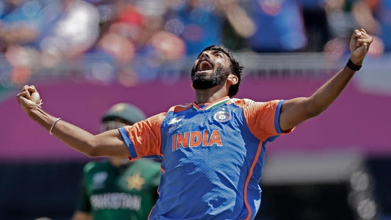 India's Jasprit Bumrah celebrates the dismissal of Pakistan's captain Babar...
