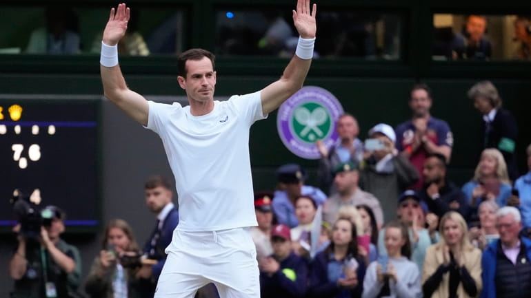 Britain's Andy Murray waves to the Center Court crowd as...