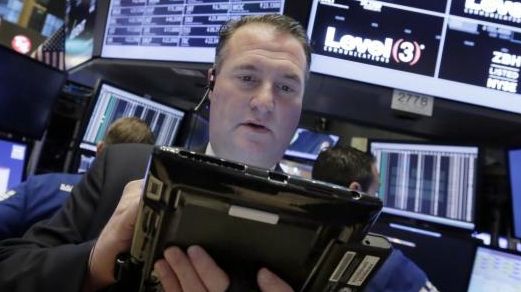 Trader Jonathan Corpina works on the floor of the New...