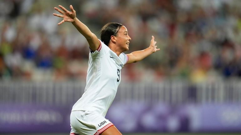 United States' Mallory Swanson reacts after scoring her side's second...