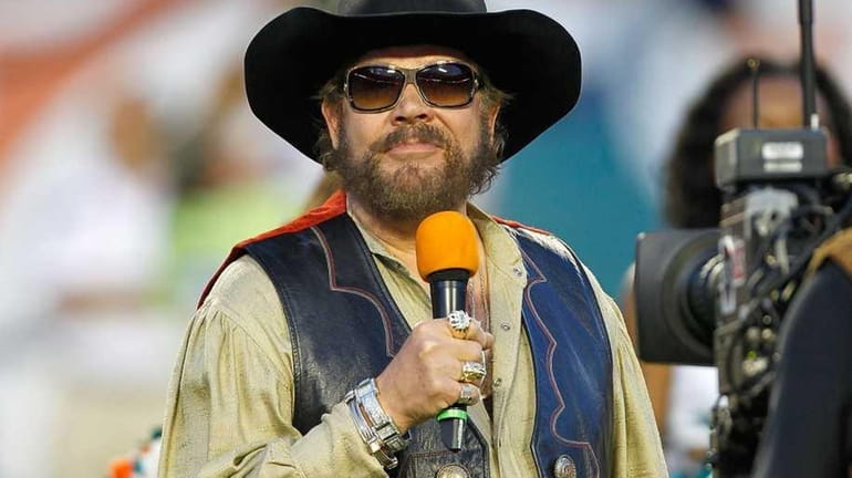 Country singer Hank Williams Jr. greets the crowd during a...