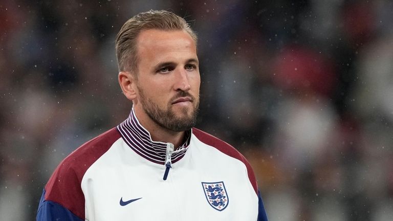 England's Harry Kane listens to the anthem before the Group...