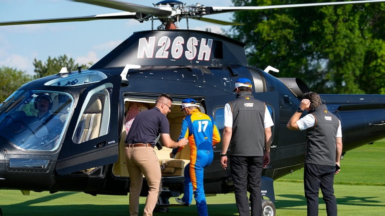 Kyle Larson boards a helicopter after qualifying for the Indianapolis...