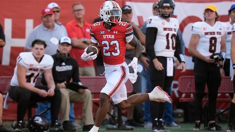 Utah running back Dijon Stanley (23) carries the ball for...