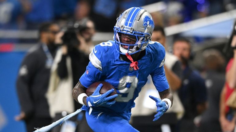 Detroit Lions wide receiver Jameson Williams (9) catches a 52-yard...