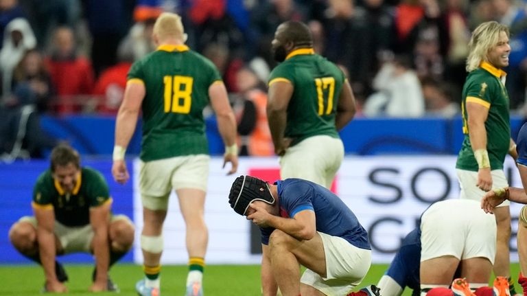 France's Antoine Dupont reacts after his side lost to South...