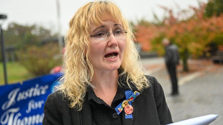 Justyna Zubko-Valva, mother of Thomas Valva, speaks outside Suffolk County...