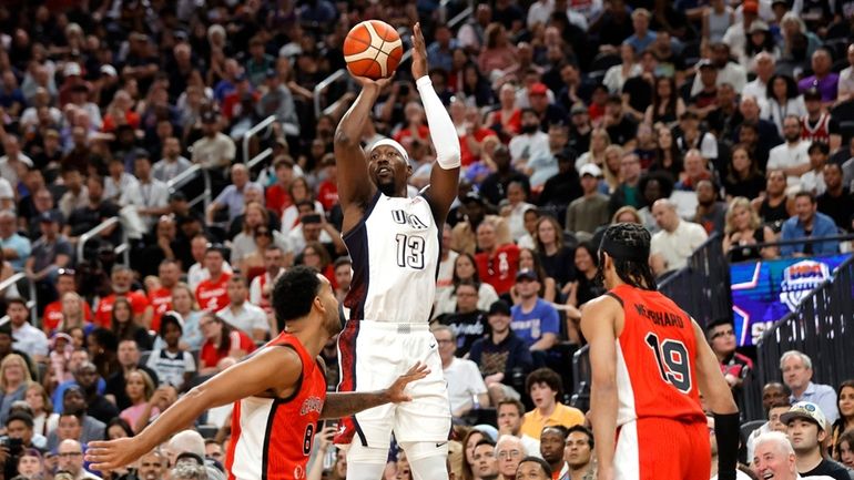 United States center Bam Adebayo (13) shoots between Canada power...