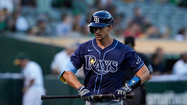 Tampa Bay Rays' Rob Brantly walks to the dugout after...